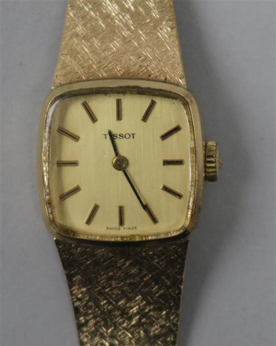 A ladys 9ct gold Tissot wristwatch.